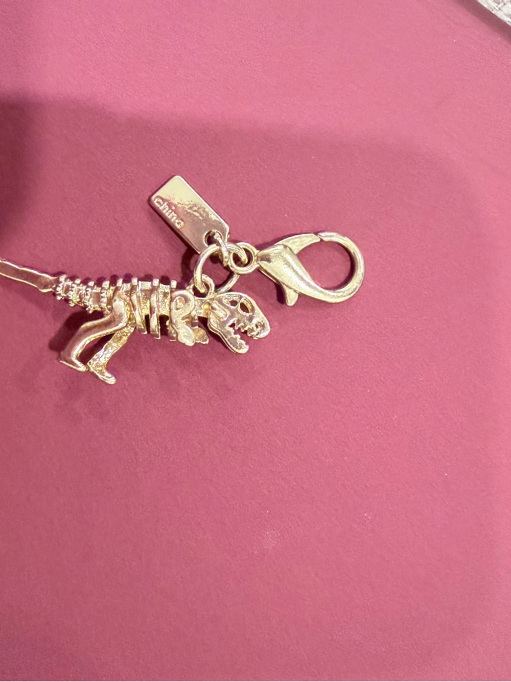 Coach Gold-tone Dinosaur Skeleton Charm Keyring
